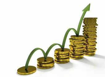 Business Graph with arrow and coins showing profits and gains