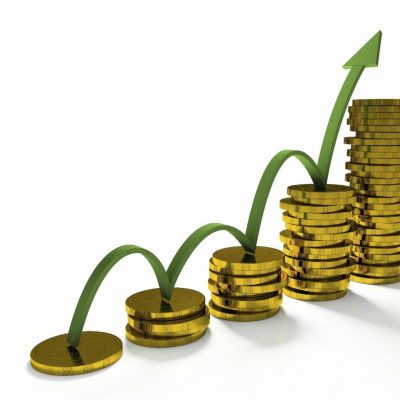 Business Graph with arrow and coins showing profits and gains