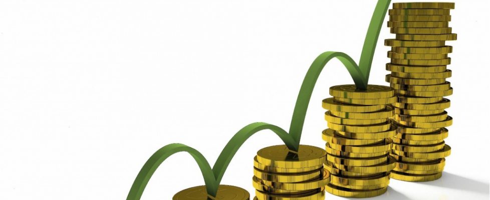 Business Graph with arrow and coins showing profits and gains