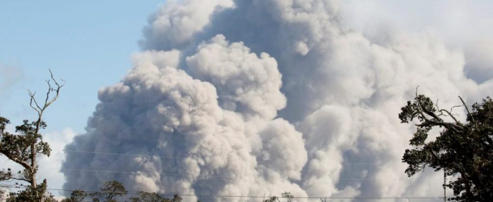 Ash erupts from Halemaumau Crater near the community of Volcano